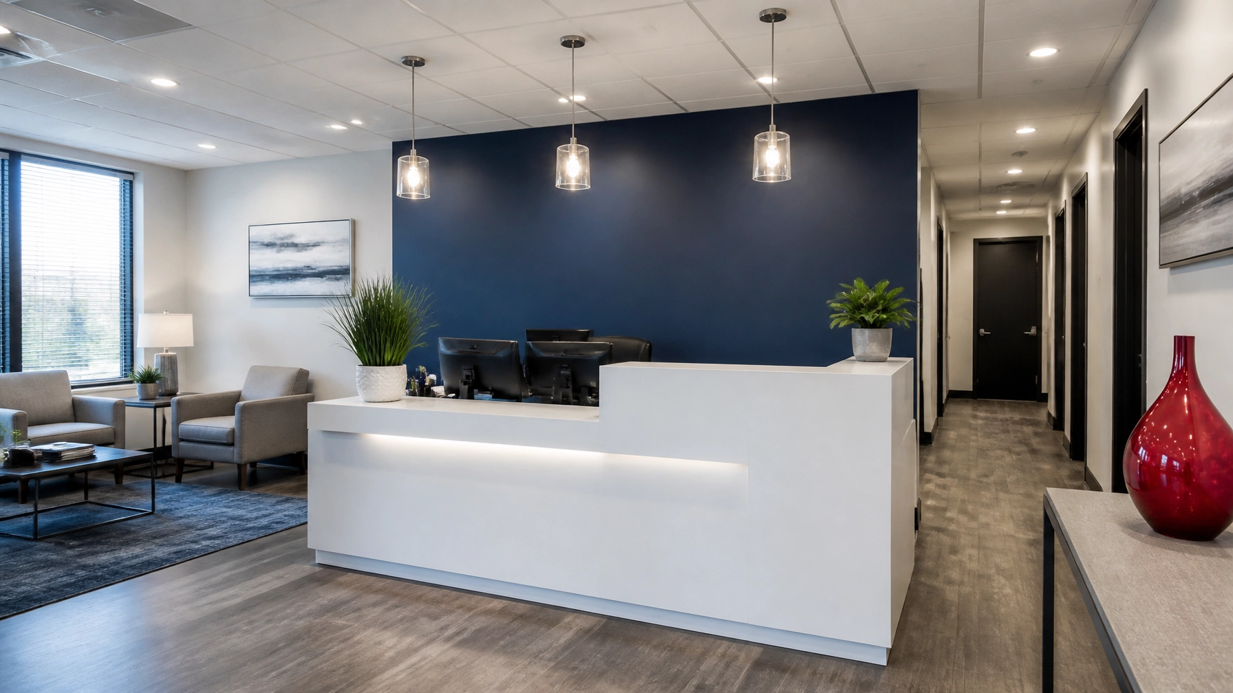 Wide-angle shot of a clean, professional agency reception area