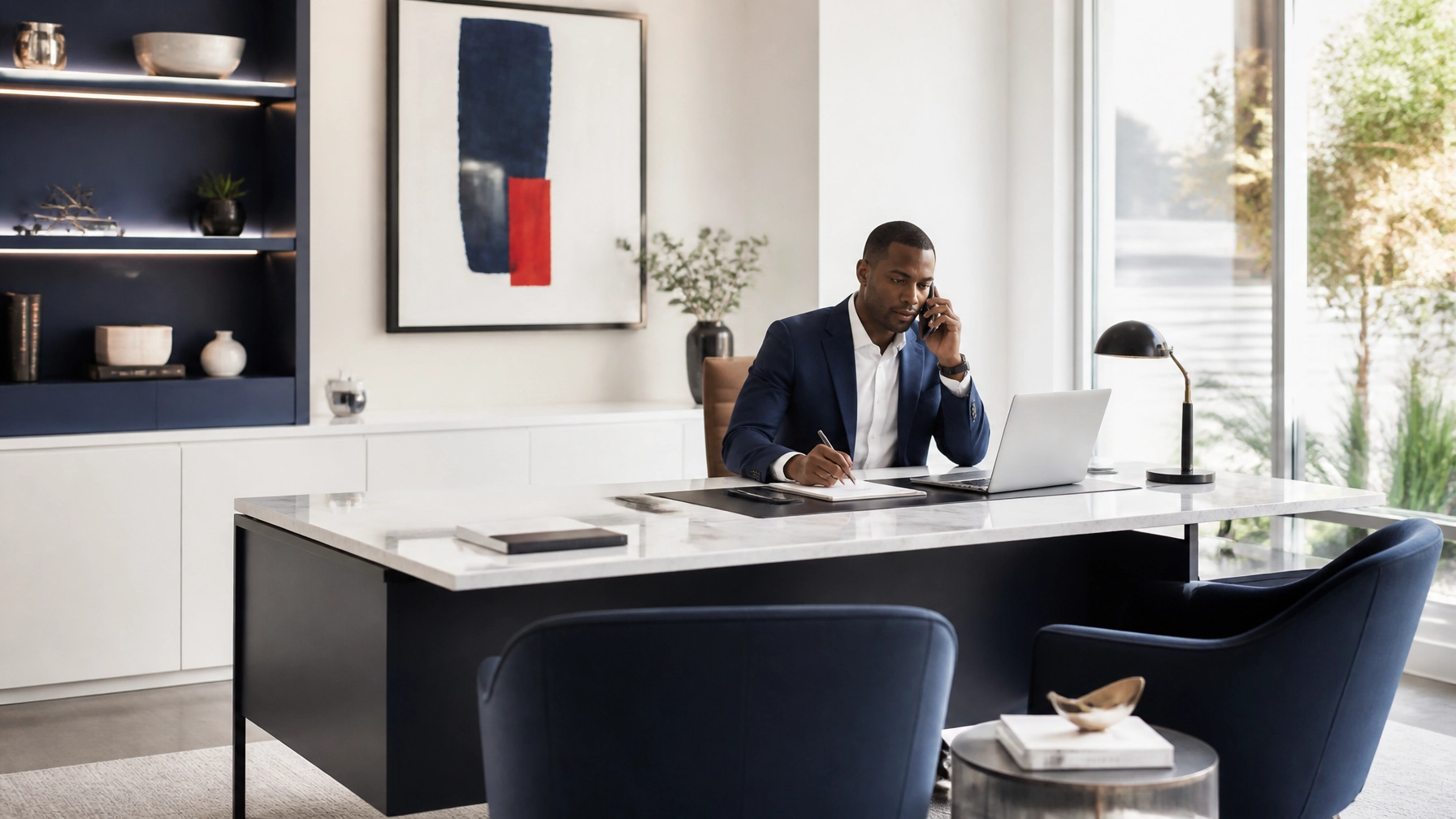 High-end minimalist private insurance office with an African American male agent on a clear business call at a tidy desk, highlighting reliable managed technology without visible clutter.